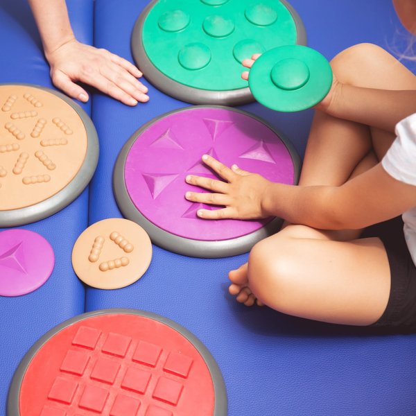 How Can Sensory Gardens in Urban Schools Support Children with Sensory Processing Disorders?